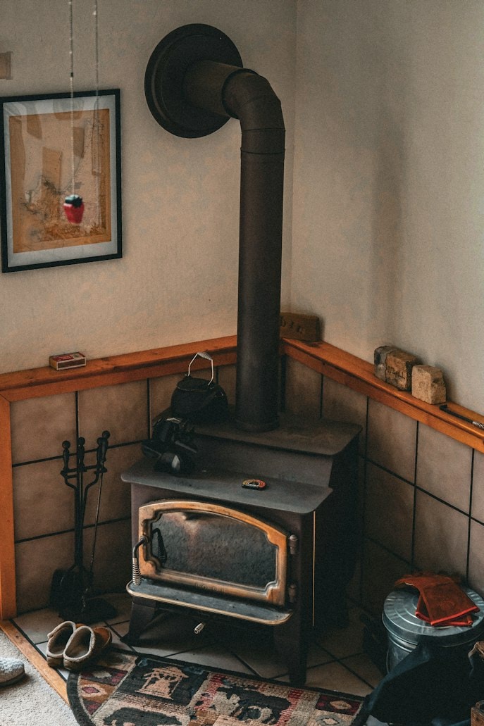 Vintage wood stove with chimney pipe